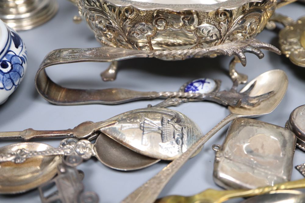 A silver sugar bowl and cream jug, a pair of nut dishes and sundry small silver